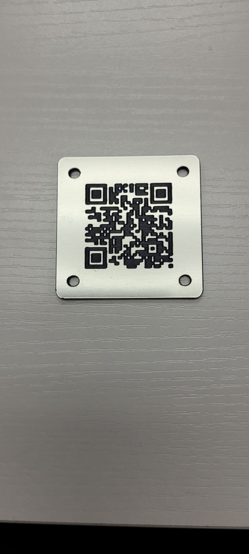 QR plaque linking Everwood products to cleanup stories