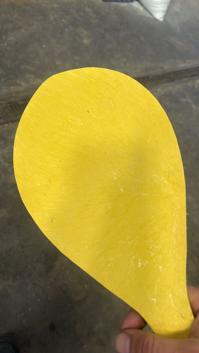 Yellow molded beach paddle