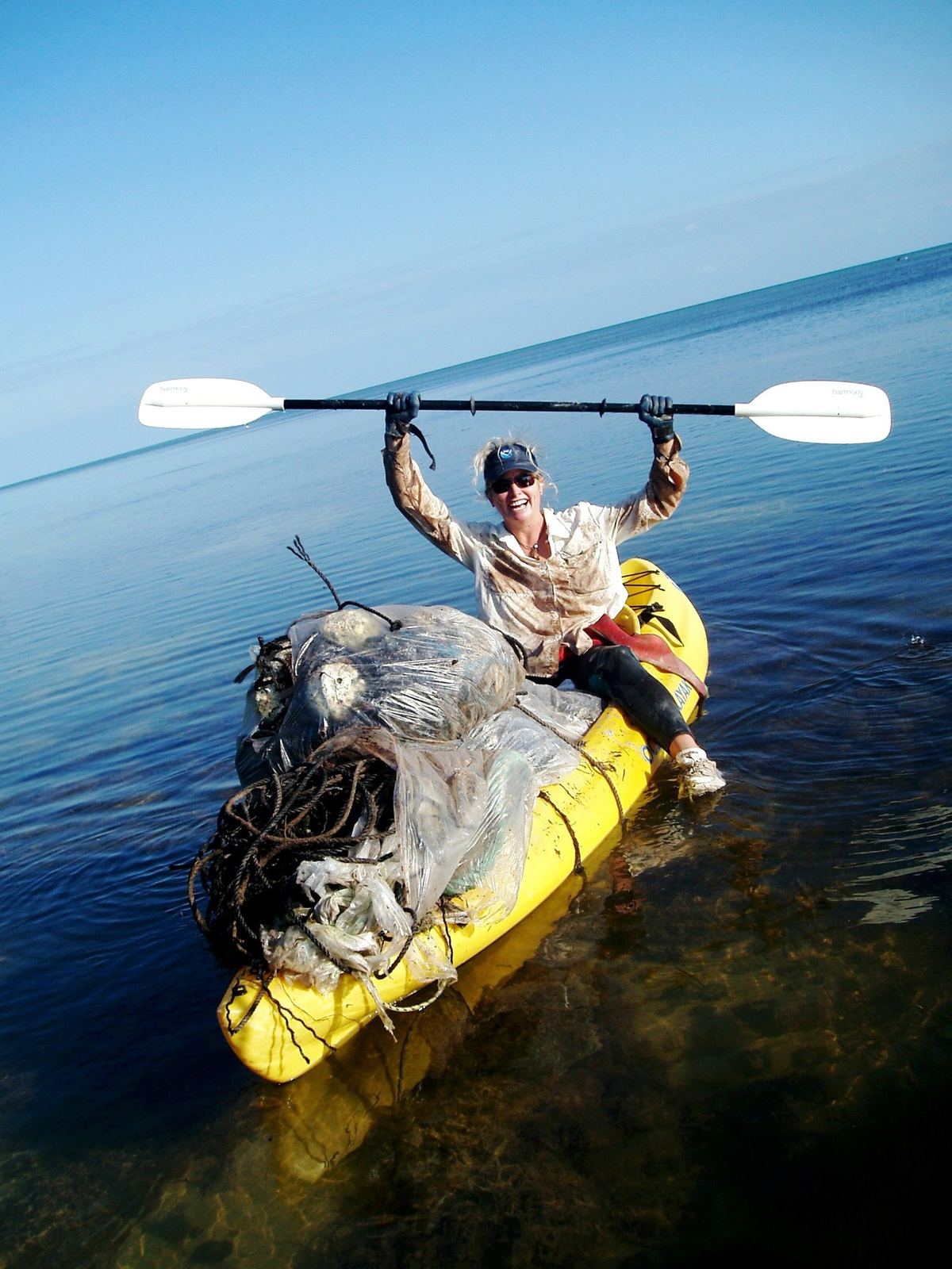 Kayaker with collected marine debris in the Florida Keys