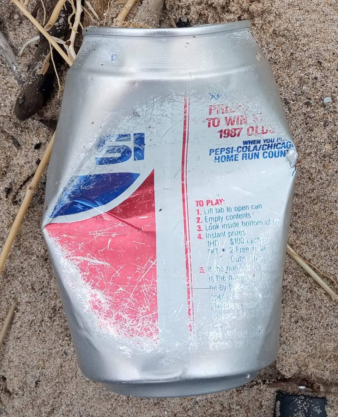 Weathered Pepsi can on a beach strandline
